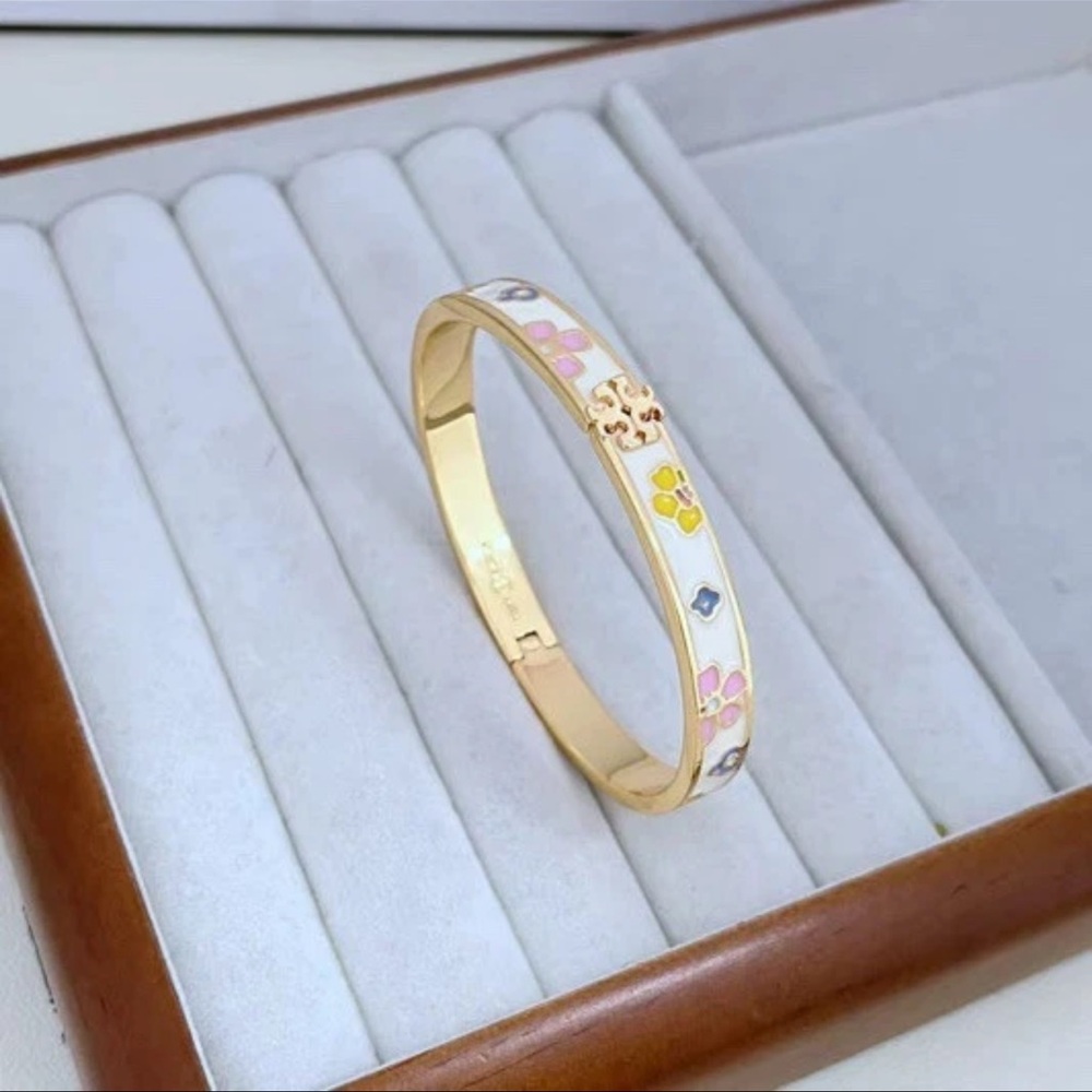 Tory Burch Gold and White Floral Bracelet